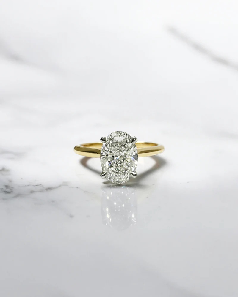  Exquisite Oval Diamond Engagement Ring with Two-Tone Cathedral Style